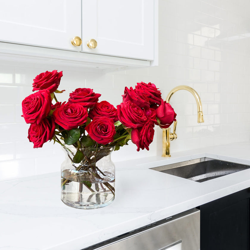 red naomi roses in vase in kitchen for valentines day anniversary flowers