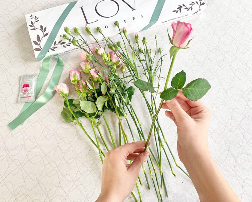 removing leaves from flower stem