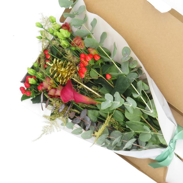 Christmas flowers in a box that is delivered through the letterbox, by LOV Flowers