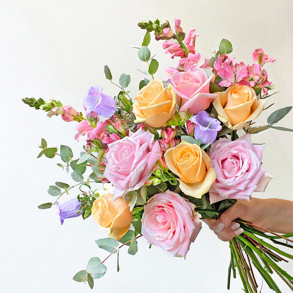 Colourful flower bouquet with pink and peach roses