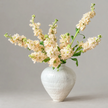 cream stock in white vase