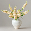 cream stock in white vase
