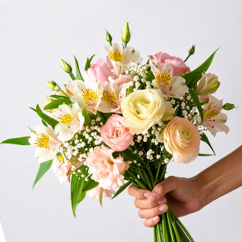 Hand-tied bouquet of seasonal pastel British flowers – fresh spring blooms