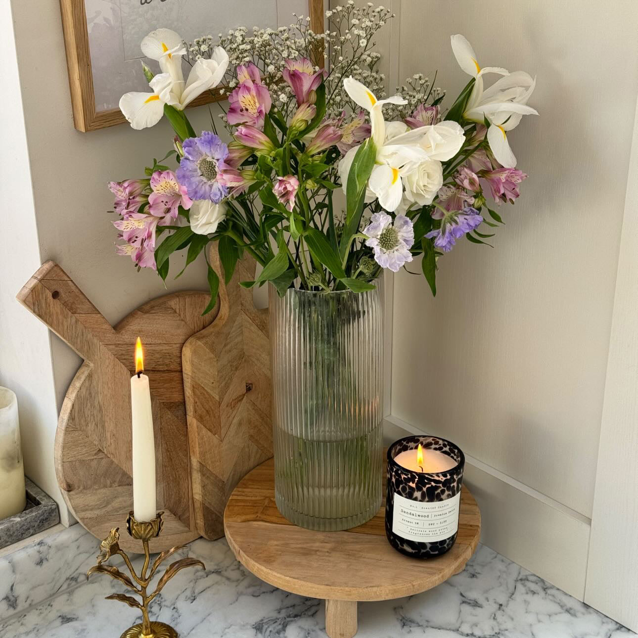 British flowers in soft colours in a vase on a kitchen counter
